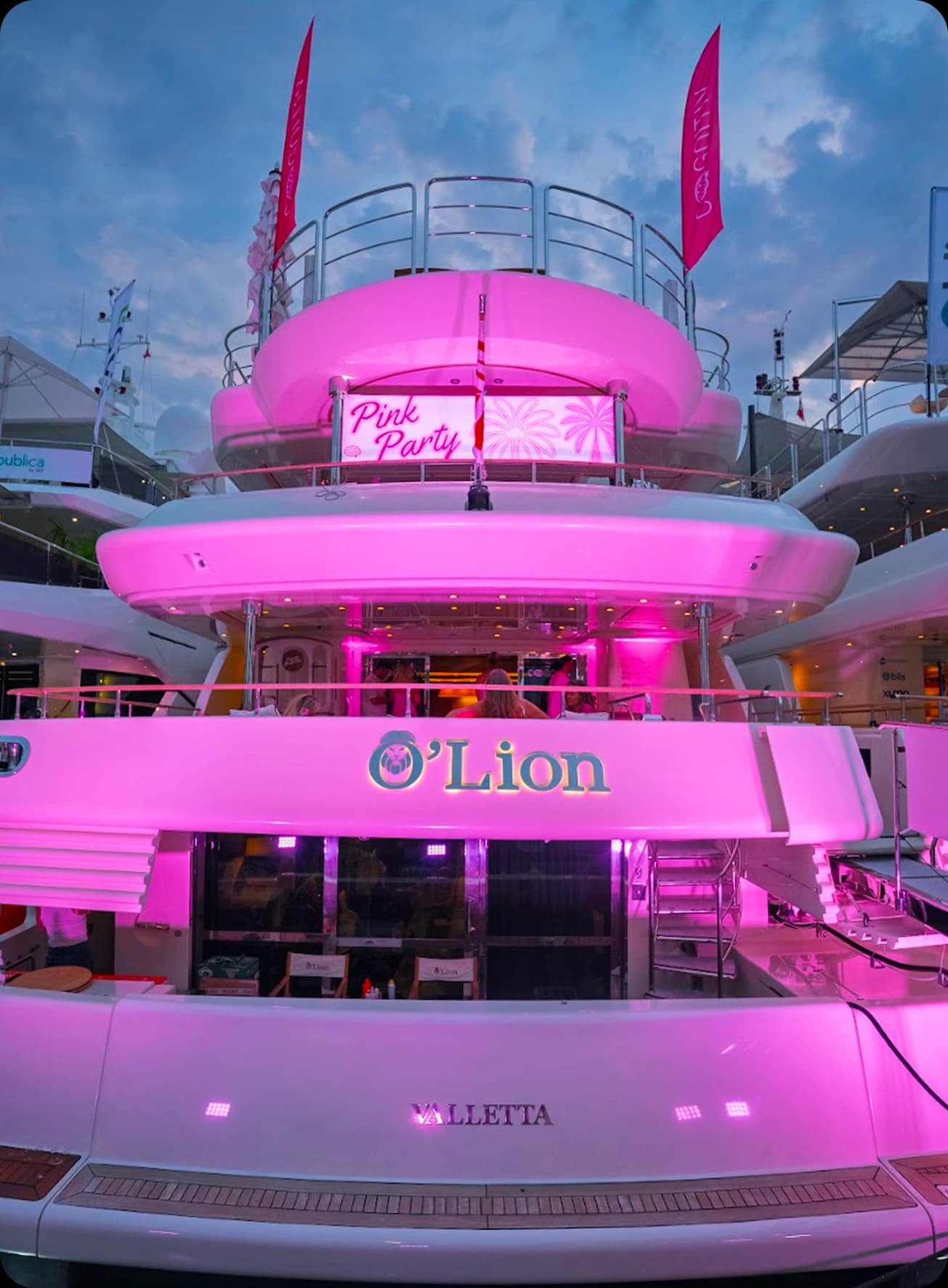 Pink party yacht at night