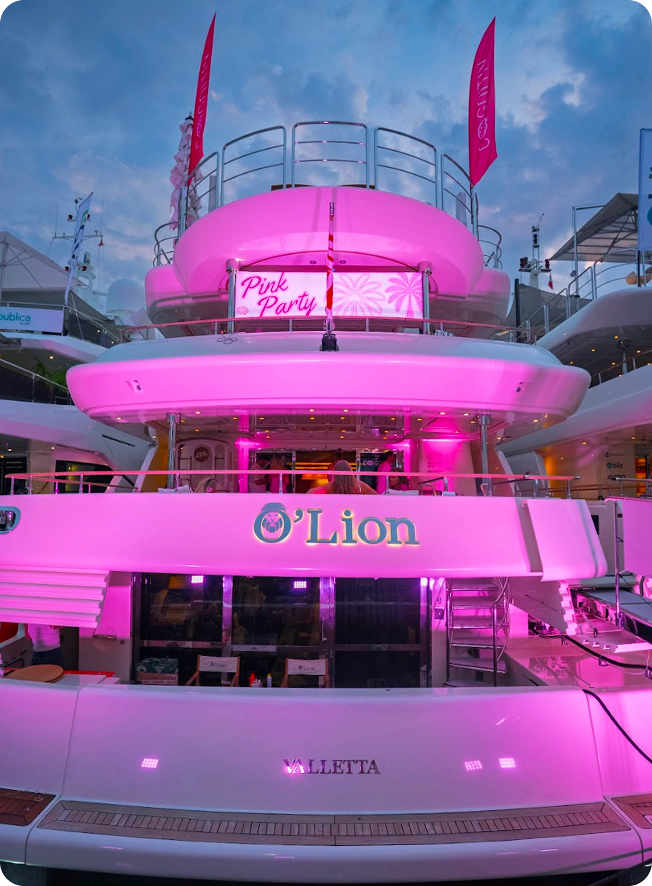 Pink party yacht at night
